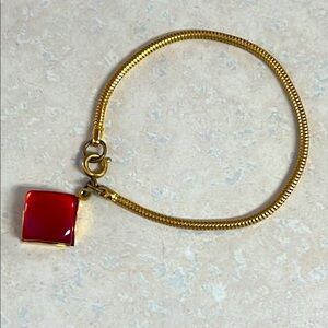 Vintage Gold Toned Bracelet with Red Charm Diamond shaped Ruby Color Charm